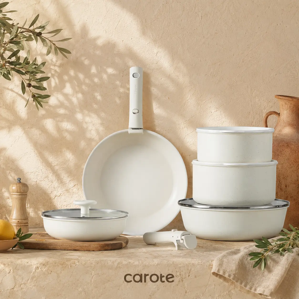 Cream cookware set arranged on a warm kitchen background